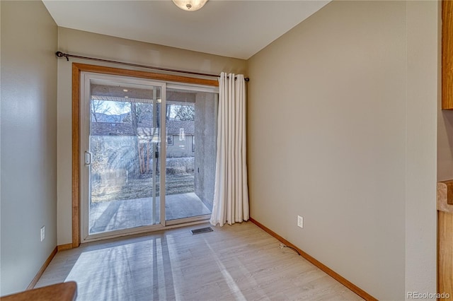 entryway with light hardwood / wood-style flooring