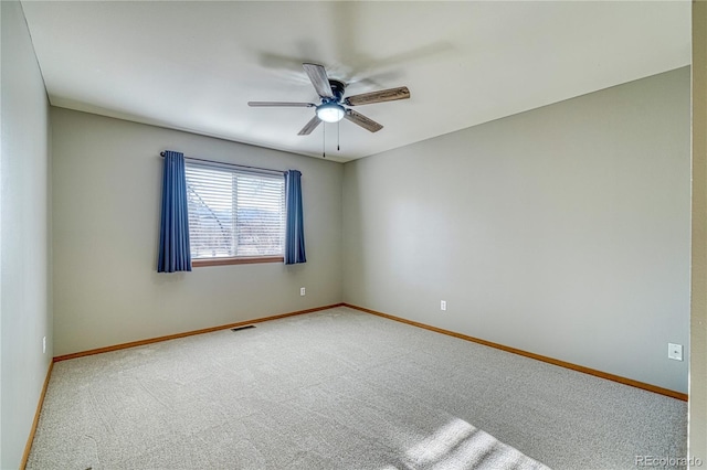 carpeted empty room featuring ceiling fan