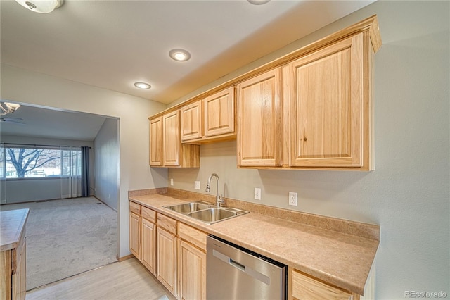 kitchen featuring light carpet, stainless steel dishwasher, light brown cabinets, and sink