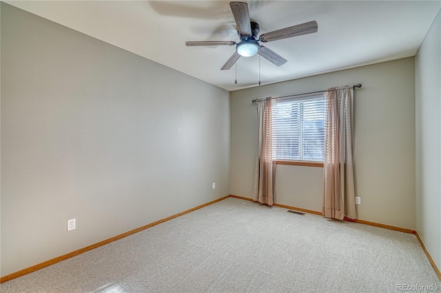 carpeted empty room with ceiling fan