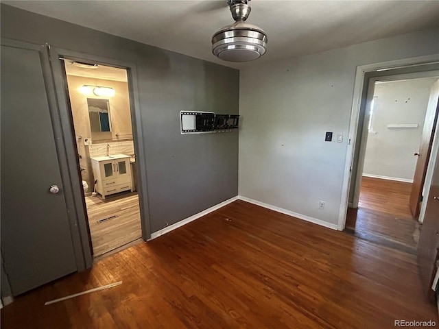 8319 Quivas Way, Denver, CO 80221 - unfurnished dining area with wood finished floors and baseboards