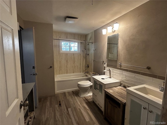 8319 Quivas Way, Denver, CO 80221 - bathroom featuring vanity, wood finished floors, and bathtub / shower combination