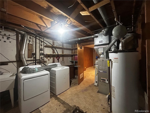 8319 Quivas Way, Denver, CO 80221 - unfinished basement featuring washer and clothes dryer and gas water heater