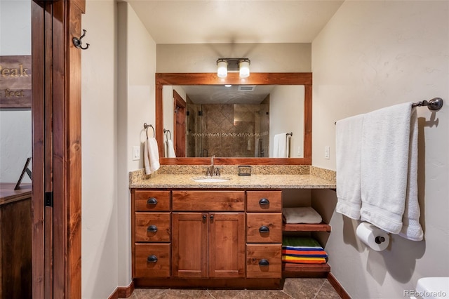 145 Cozens Pointe Unit F101, Fraser, CO 80442 - bathroom featuring vanity, an enclosed shower, and baseboards