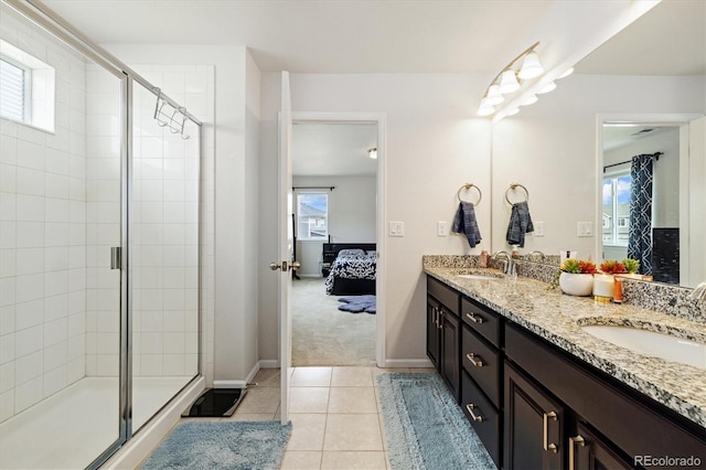 full bath featuring a shower stall and a sink