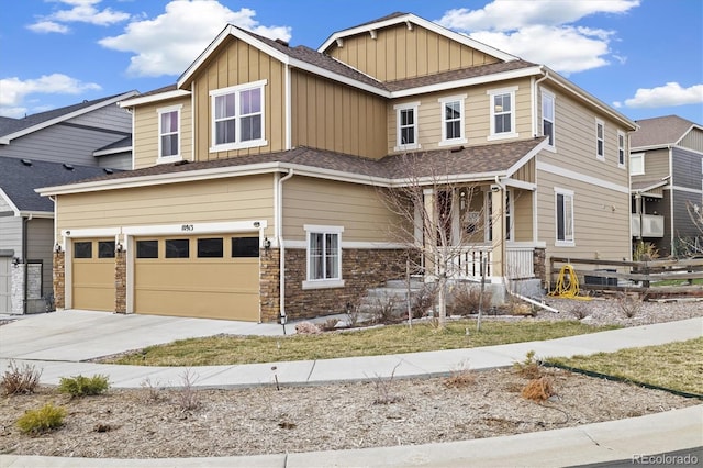 10913 Ledges Rd, Parker, CO 80134 - craftsman-style house featuring board and batten siding, a garage, concrete driveway, and stone siding