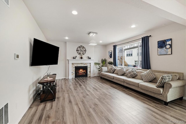 10913 Ledges Rd, Parker, CO 80134 - living area featuring light wood-type flooring, recessed lighting, and a fireplace