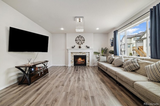 10913 Ledges Rd, Parker, CO 80134 - living room with wood finished floors, recessed lighting, and a stone fireplace