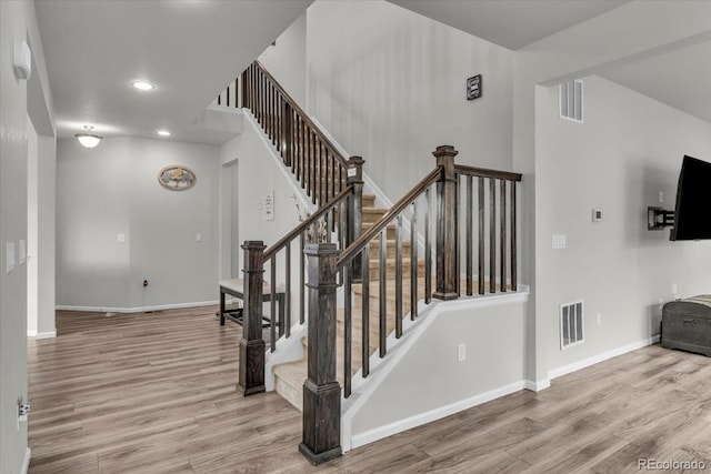 10913 Ledges Rd, Parker, CO 80134 - staircase with wood finished floors and recessed lighting