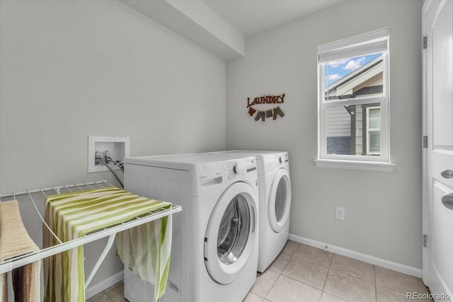 10913 Ledges Rd, Parker, CO 80134 - laundry area featuring washing machine and clothes dryer and light tile patterned floors