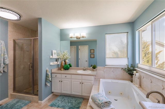 full bathroom featuring a shower stall, vanity, a tub with jets, and tile patterned flooring