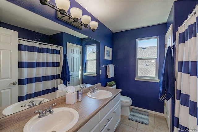 full bath with a wealth of natural light and a sink