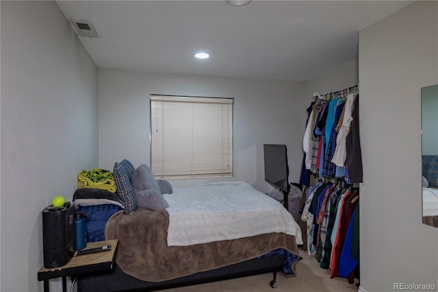 bedroom featuring visible vents, recessed lighting, and carpet