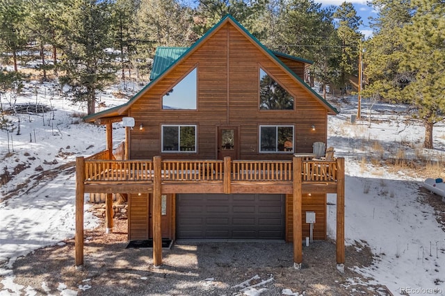 exterior space featuring a garage and a deck