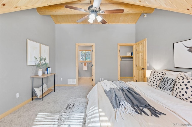 carpeted bedroom with connected bathroom, wood ceiling, a spacious closet, high vaulted ceiling, and beam ceiling