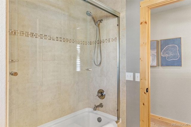 bathroom featuring enclosed tub / shower combo