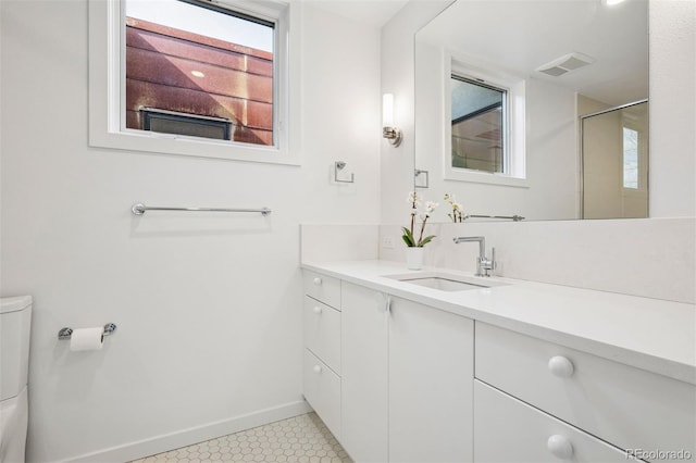 full bath with visible vents, vanity, toilet, baseboards, and tile patterned floors