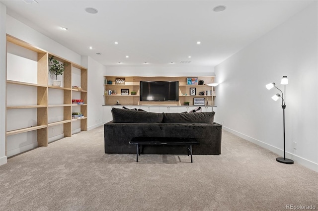 living room with baseboards and light carpet