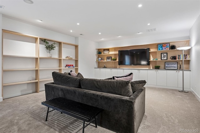 living room featuring recessed lighting, visible vents, and light carpet