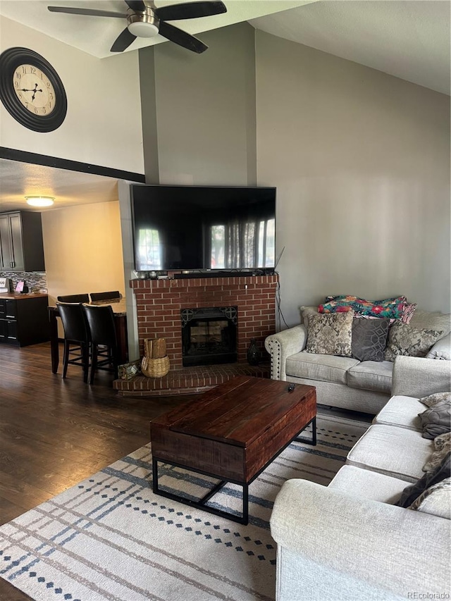 1254 S Reed St Unit 1, Lakewood, CO 80232 - living area featuring high vaulted ceiling, wood finished floors, ceiling fan, and a fireplace