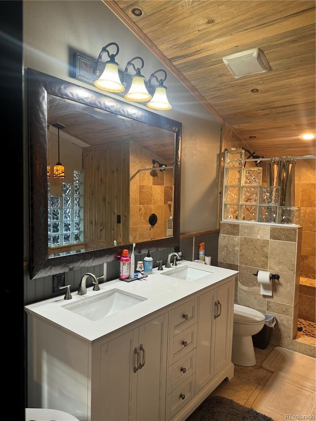 1254 S Reed St Unit 1, Lakewood, CO 80232 - full bathroom with wood ceiling, tiled shower, double vanity, tile walls, and a wainscoted wall