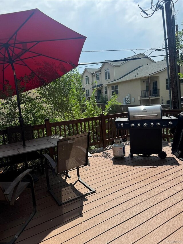 1254 S Reed St Unit 1, Lakewood, CO 80232 - wooden deck with area for grilling and outdoor dining space