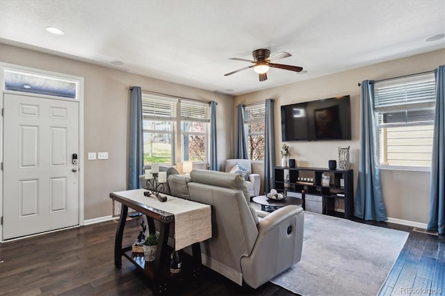 living room with a ceiling fan, baseboards, recessed lighting, and dark wood-type flooring