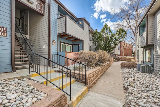 view of side of property with central AC unit