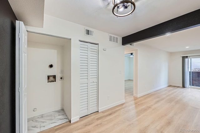 corridor featuring marble finish floor, beamed ceiling, visible vents, and baseboards