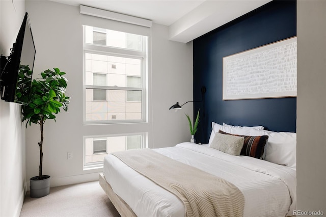 bedroom featuring light colored carpet