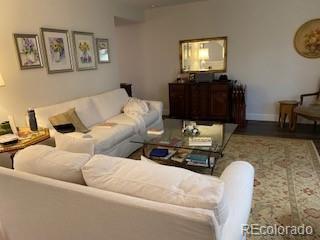 9060 E Cherry Creek S Drive E, Denver, CO 80231 - living area featuring wood finished floors and baseboards
