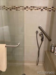 9060 E Cherry Creek S Drive E, Denver, CO 80231 - bathroom featuring tiled shower