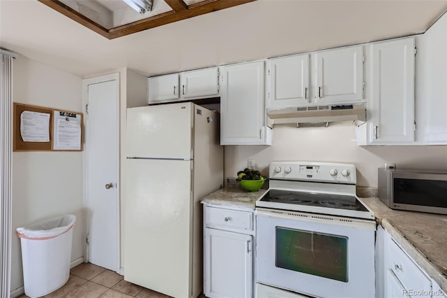 kitchen with light countertops, white cabinetry, white appliances, and under cabinet range hood