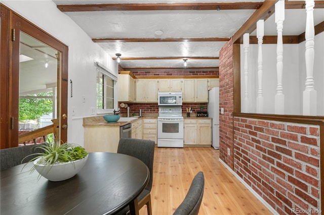 16308 E Wyoming Dr, Aurora, CO 80017 - kitchen featuring white appliances, light wood finished floors, light countertops, beam ceiling, and brick wall