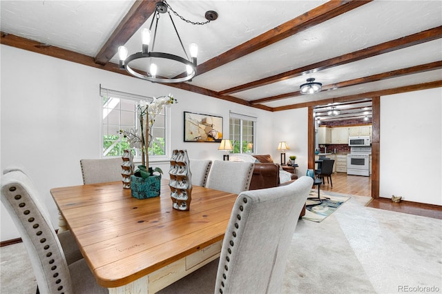 16308 E Wyoming Dr, Aurora, CO 80017 - carpeted dining room with a chandelier and beam ceiling