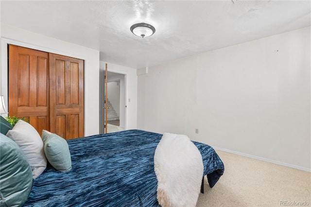 16308 E Wyoming Dr, Aurora, CO 80017 - carpeted bedroom with baseboards and a closet