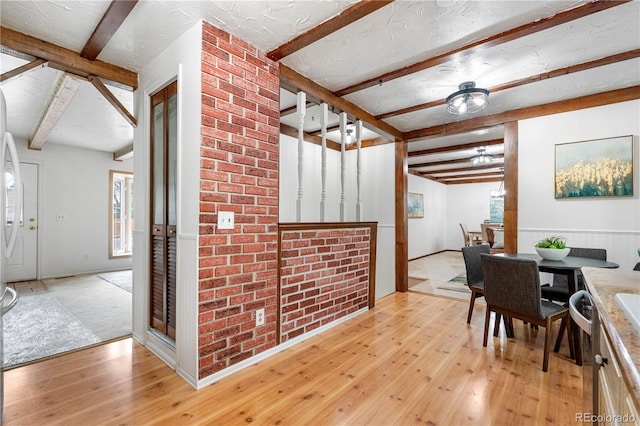 16308 E Wyoming Dr, Aurora, CO 80017 - dining space with beamed ceiling and light wood-type flooring