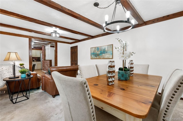 16308 E Wyoming Dr, Aurora, CO 80017 - dining area featuring beam ceiling, a chandelier, and light carpet