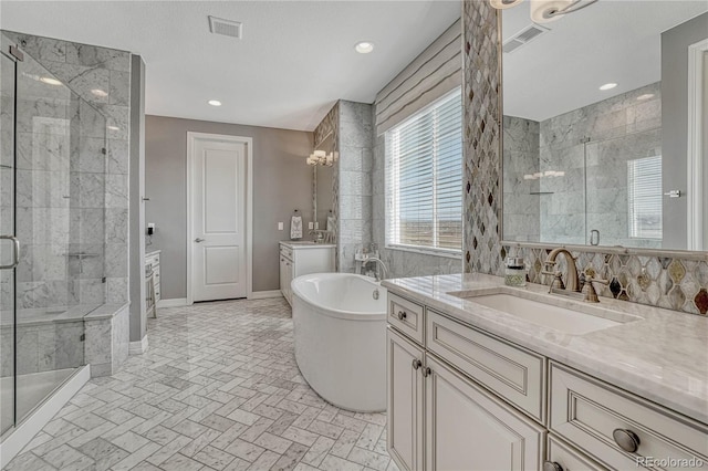 bathroom featuring plus walk in shower and vanity