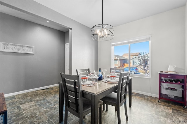 dining area featuring an inviting chandelier