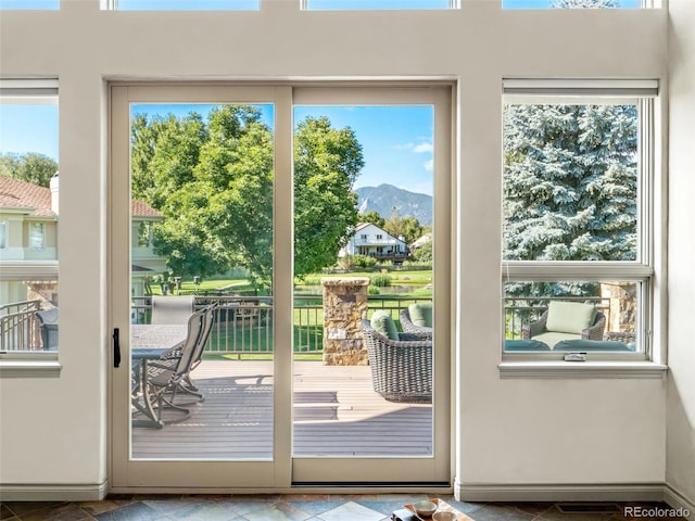 entryway featuring a mountain view and a wealth of natural light