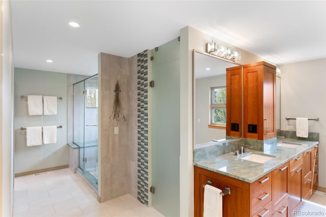 bathroom with vanity and an enclosed shower