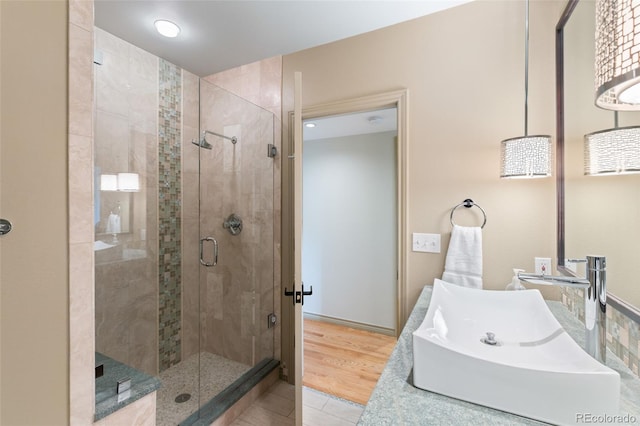 bathroom with sink, tile patterned floors, and walk in shower