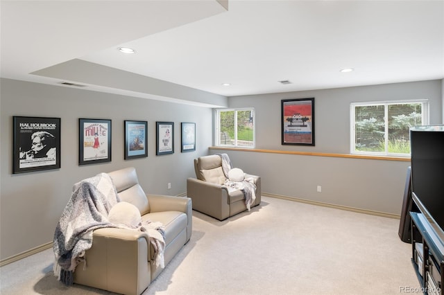 living area featuring light colored carpet