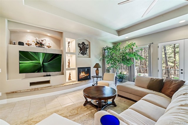 tiled living room featuring built in shelves