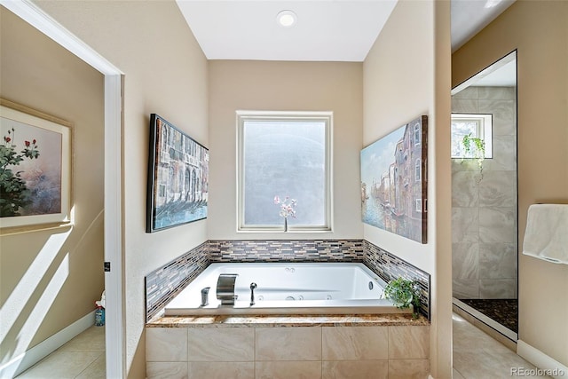 bathroom featuring independent shower and bath and tile floors