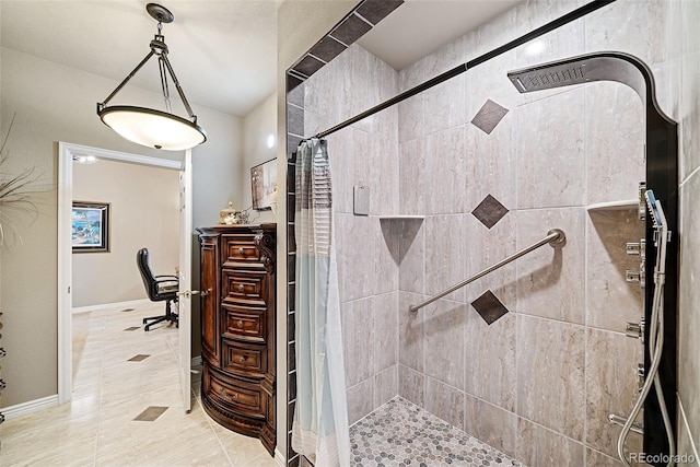 bathroom with walk in shower and tile floors