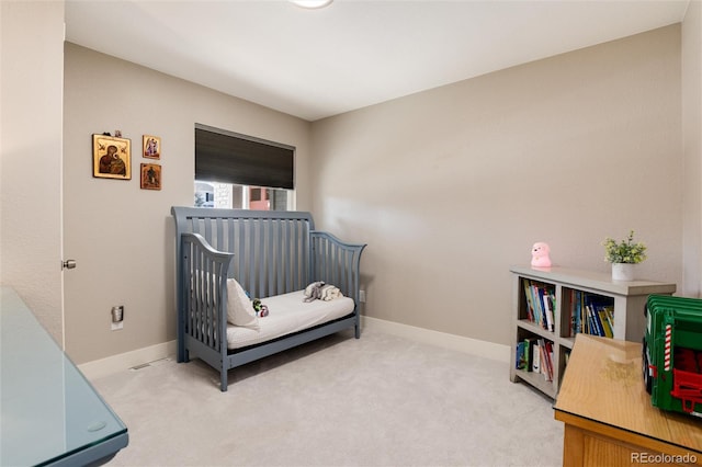 bedroom featuring carpet floors and baseboards