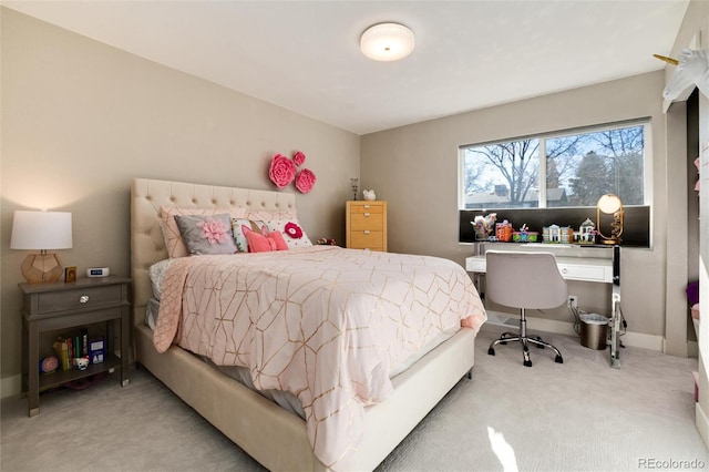 bedroom featuring carpet floors and baseboards