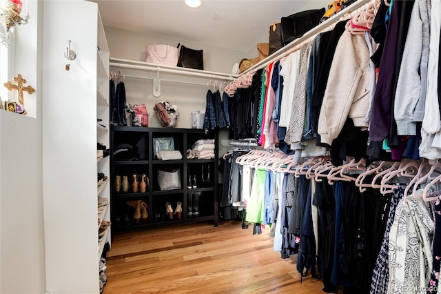 spacious closet featuring wood finished floors